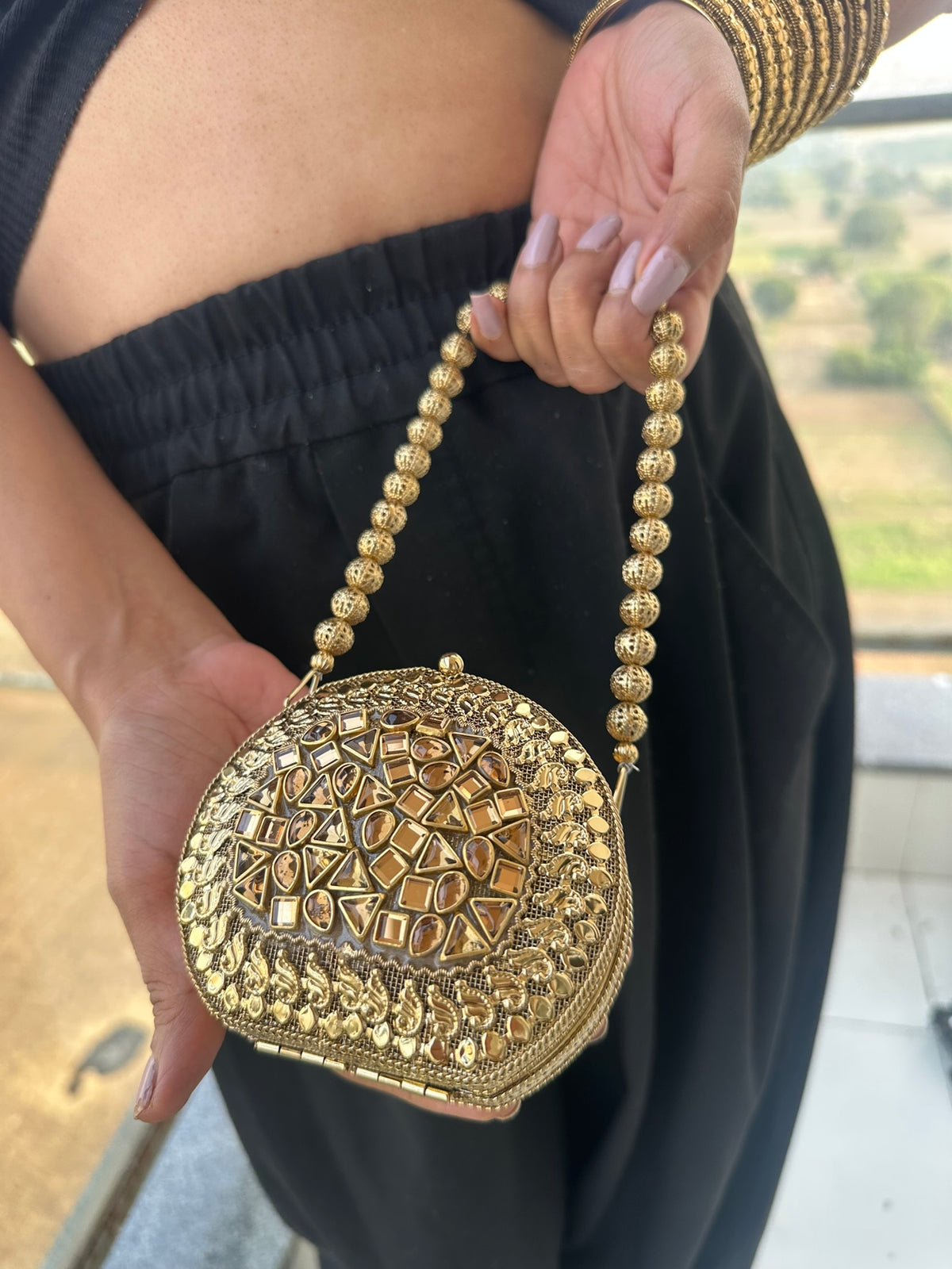 The KAVYA Handcrafted Antique Gold Oval Filigree & Amber Mirror Clutch