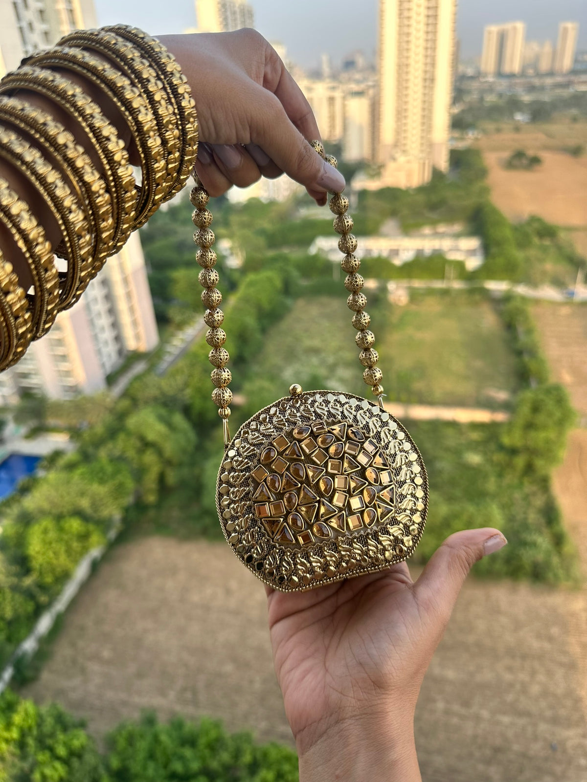 The KAVYA Handcrafted Antique Gold Oval Filigree & Amber Mirror Clutch