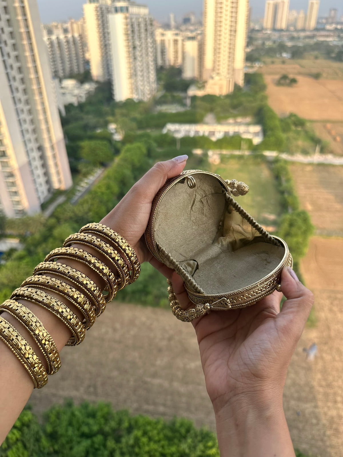 The KAVYA Handcrafted Antique Gold Oval Filigree & Amber Mirror Clutch