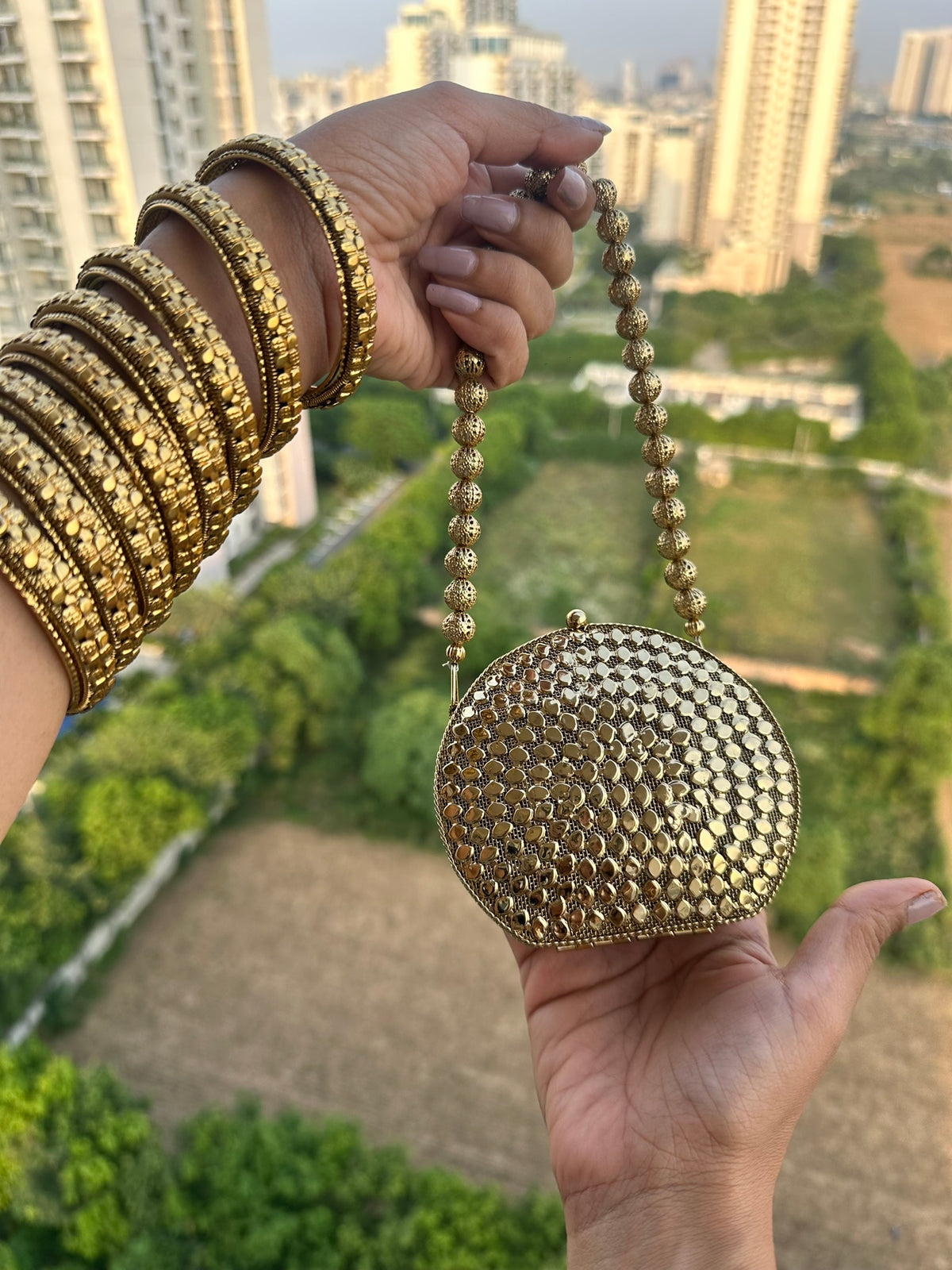 The KAVYA Handcrafted Antique Gold Oval Filigree & Amber Mirror Clutch