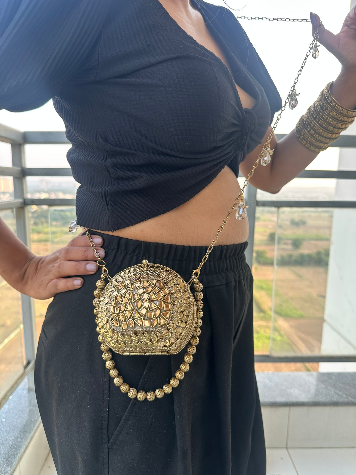 The KAVYA Handcrafted Antique Gold Oval Filigree & Amber Mirror Clutch