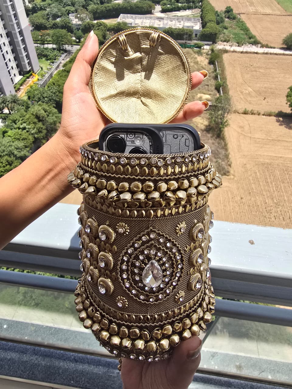 The Zara Antique Gold Cylindrical Capsule Clutch with Statement Tassel