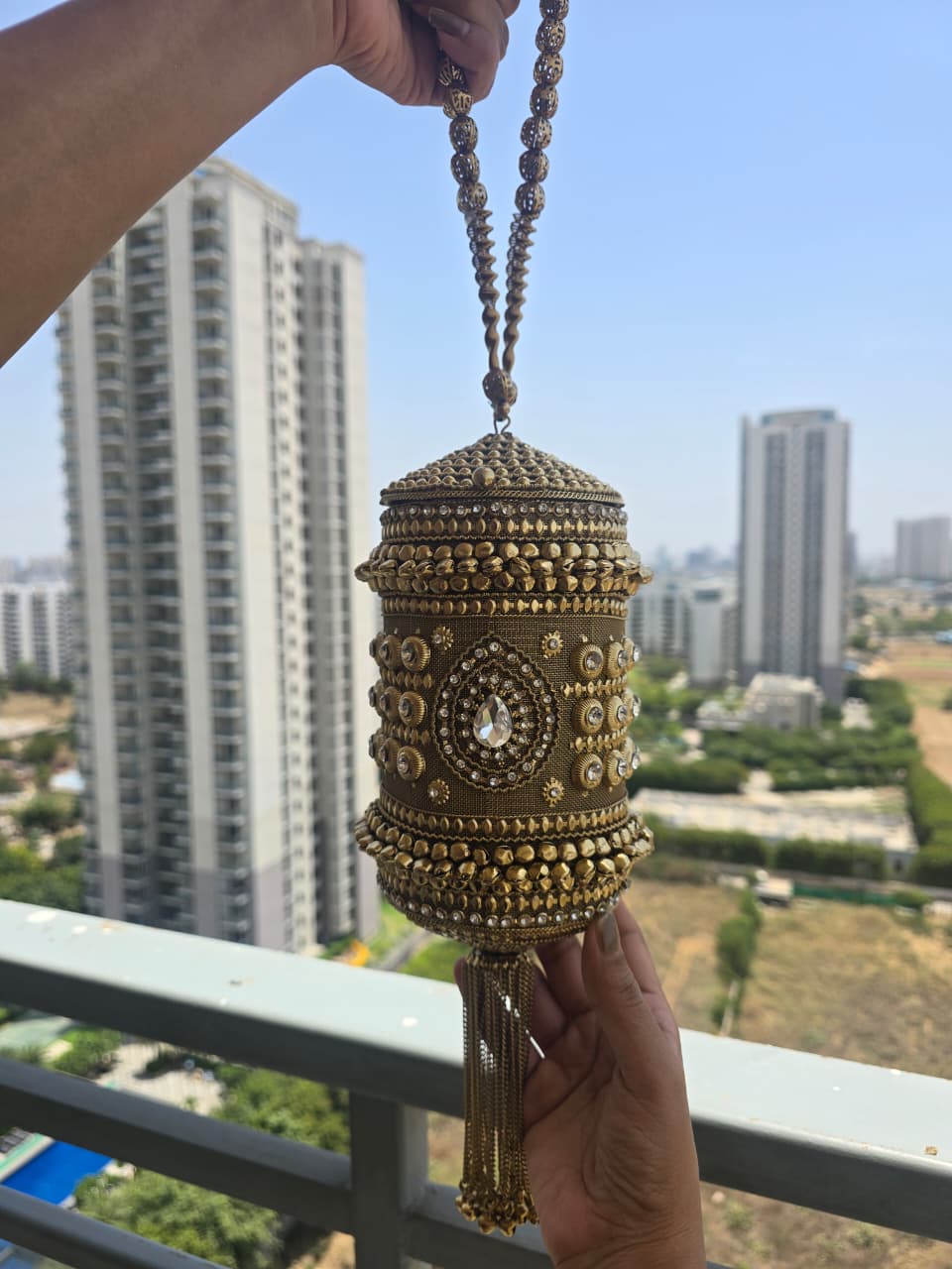 The Zara Antique Gold Cylindrical Capsule Clutch with Statement Tassel