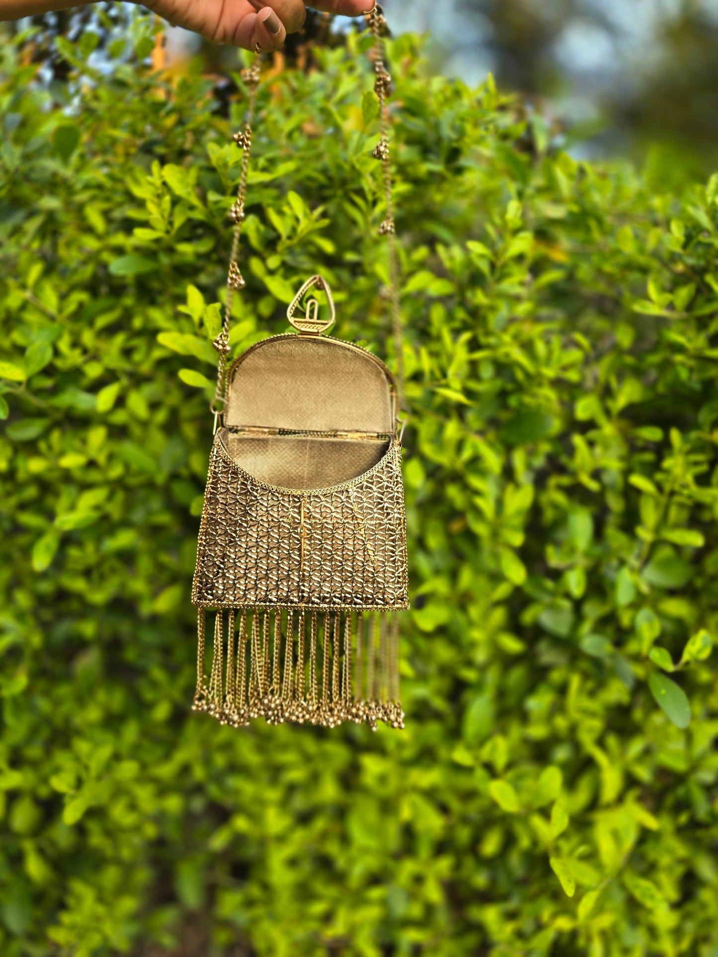 Noor Tassel Minaudière Clutch bag